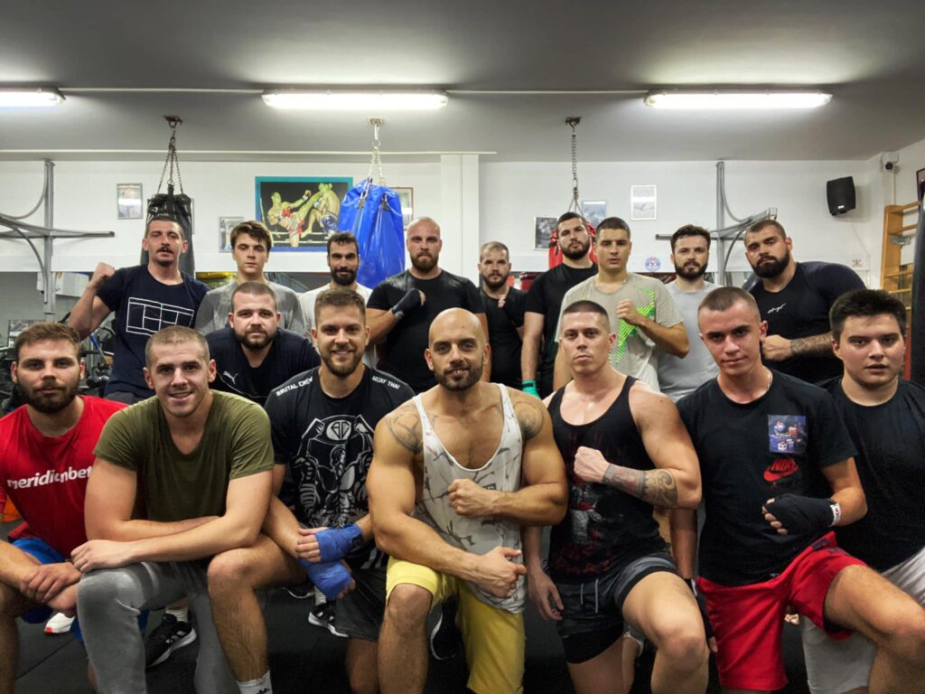 People posing for the picture in a gym from group training