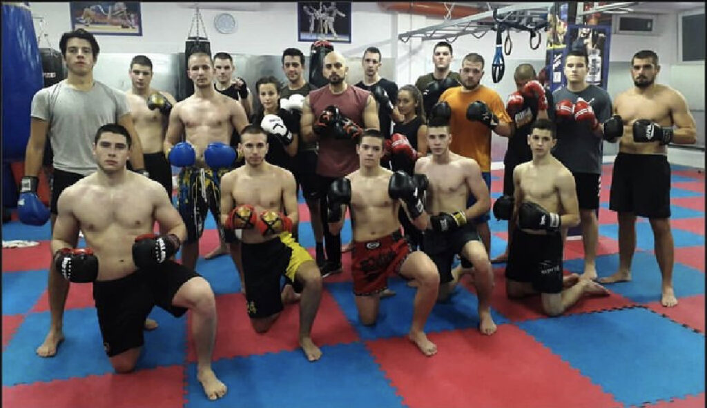 People posing for the picture in a gym